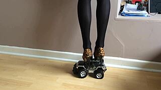 Toy car crushed under high heels
