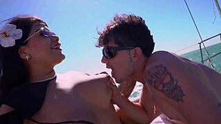 Big-breasted woman has sex on a yacht. Young guy joins her