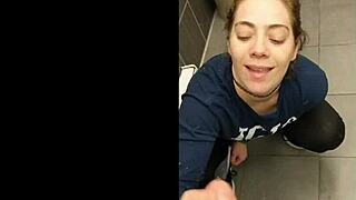 Lovely couple storms through public bathroom to engage in blowjob and handjob