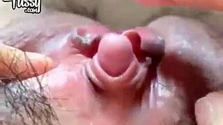 Japanese Amateur girl getting herself wet in near shots of her big clitoris